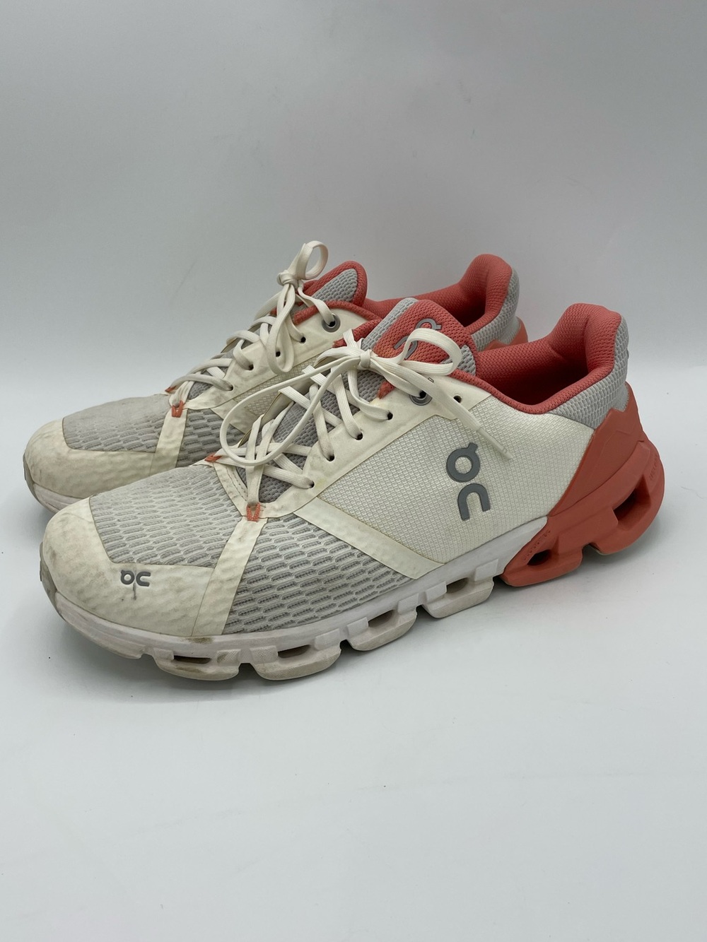 On Cloudflyer Women's Running Sneakers in Coral & Cream.